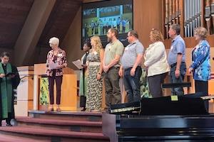 Pastor Hardy and the team welcoming six new members in worship