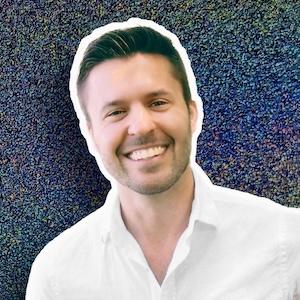 Smiling headshot of Rev Sam Lundquist on a dark glitter background