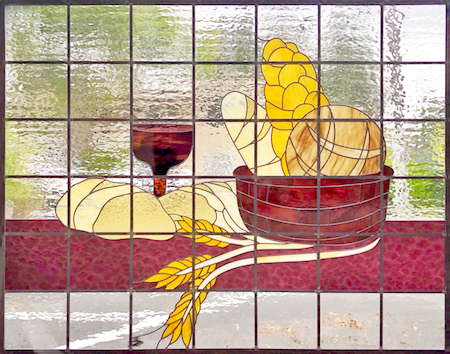 Stained glass window of Communion bread and cup