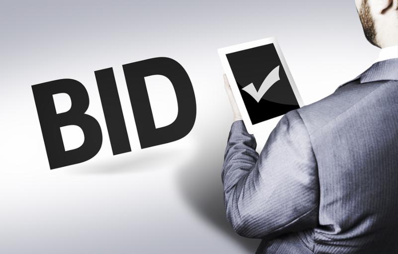 Business man with the text Bid in a concept image