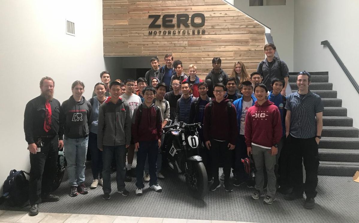 Aragon students pose with teachers in front of the Zero Motorcycles building