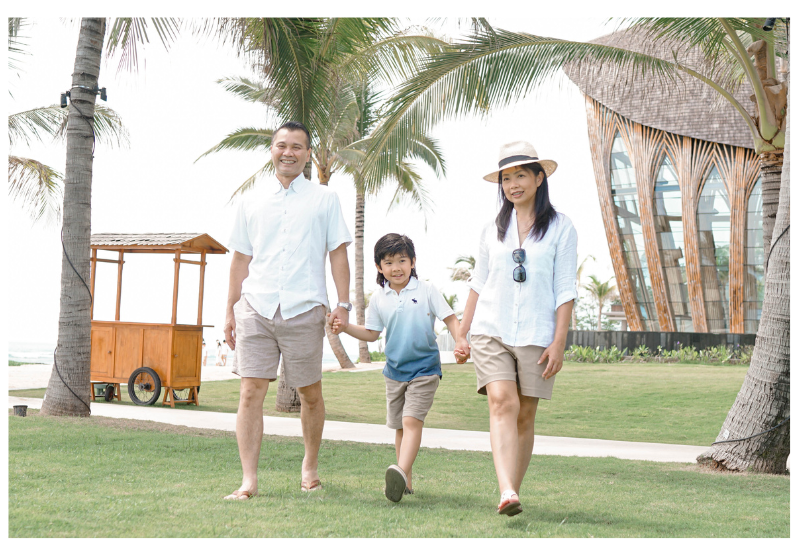 Family walking in a tropical location.