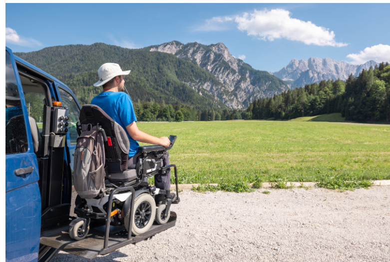 Man in wheelchair traveling on vacation. 