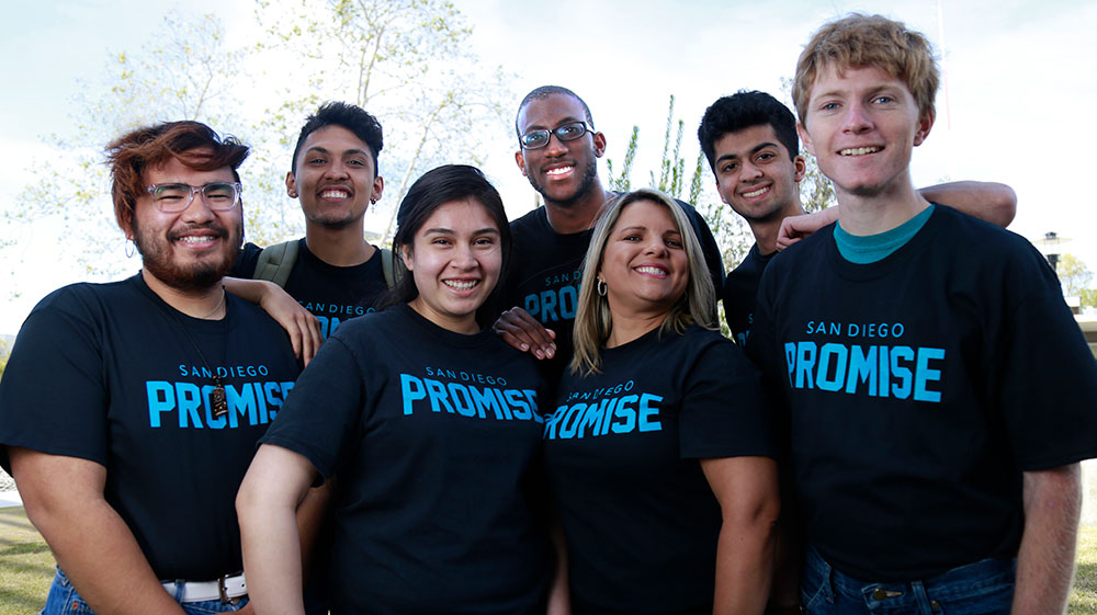 seven students wearing black tee shirts that say San Diego Promise.