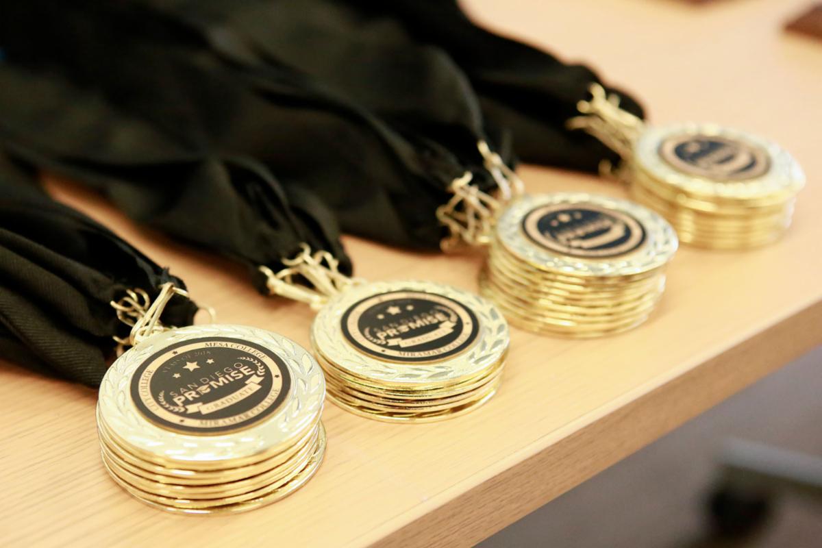 Stacks of gold promise medallions