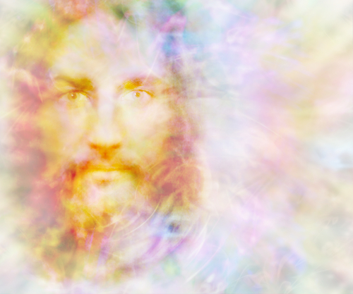 Gentle Spirit - ethereal golden light forming the face of a gentle spirit on a pastel colored energy field background with copy space on right 