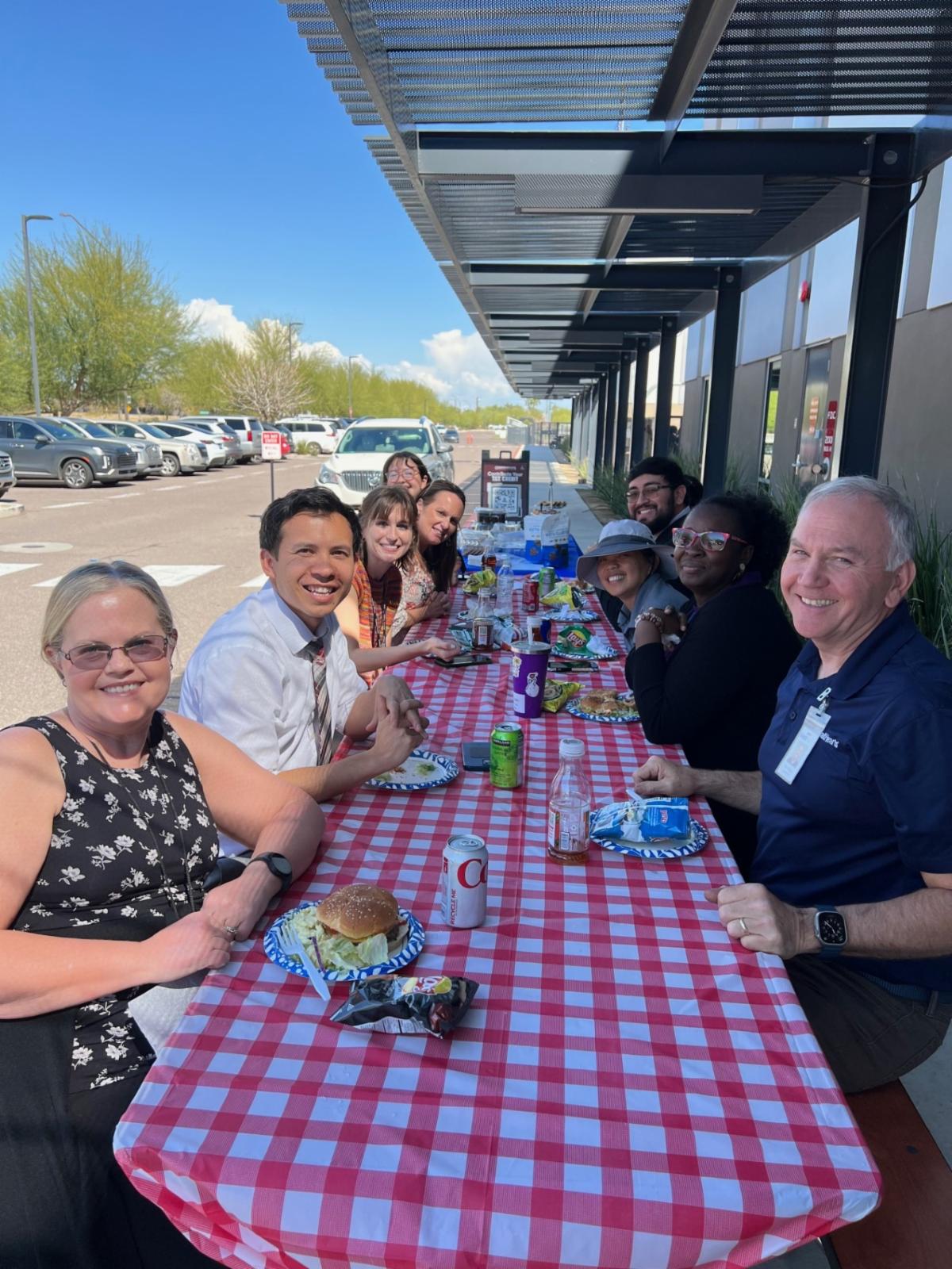 Trivium teachers enjoying a BBQ lunch.