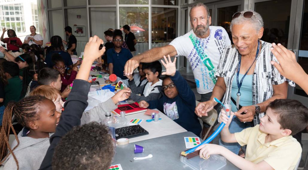 NSU Art Museum volunteers help Broward County students with art projects during a Museums on the Move visit