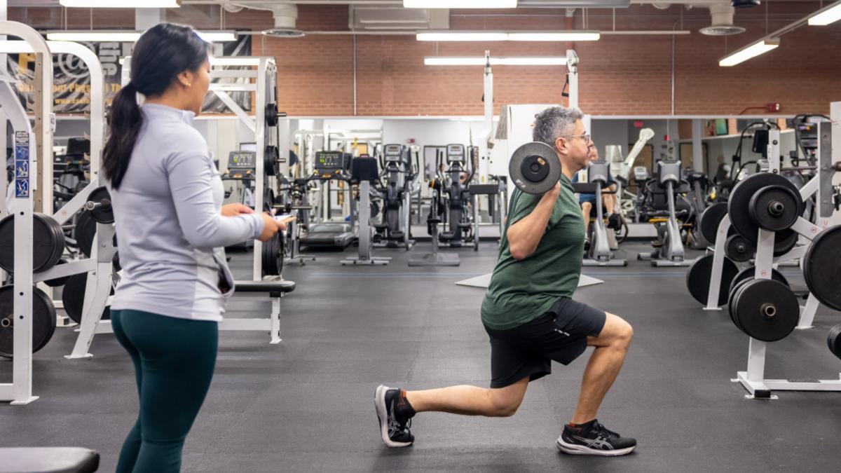 Two people in a gym