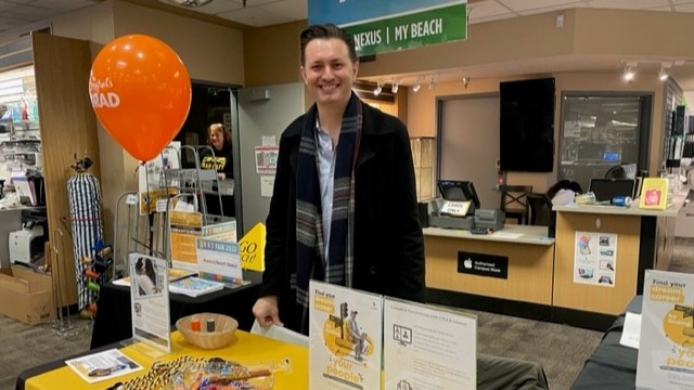 an alum volunteers during Grad Fair