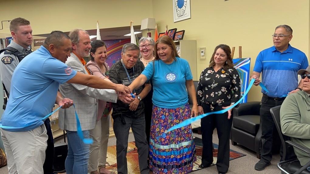 People gather in the Yorkton Public Library for the ribbon cutting at the opening of Yorkton Public Library's new Read Indigenous space.