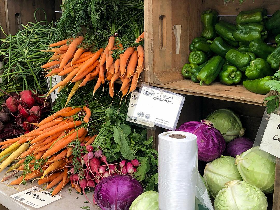 red fire farms carrots and produce at wayland farmers market