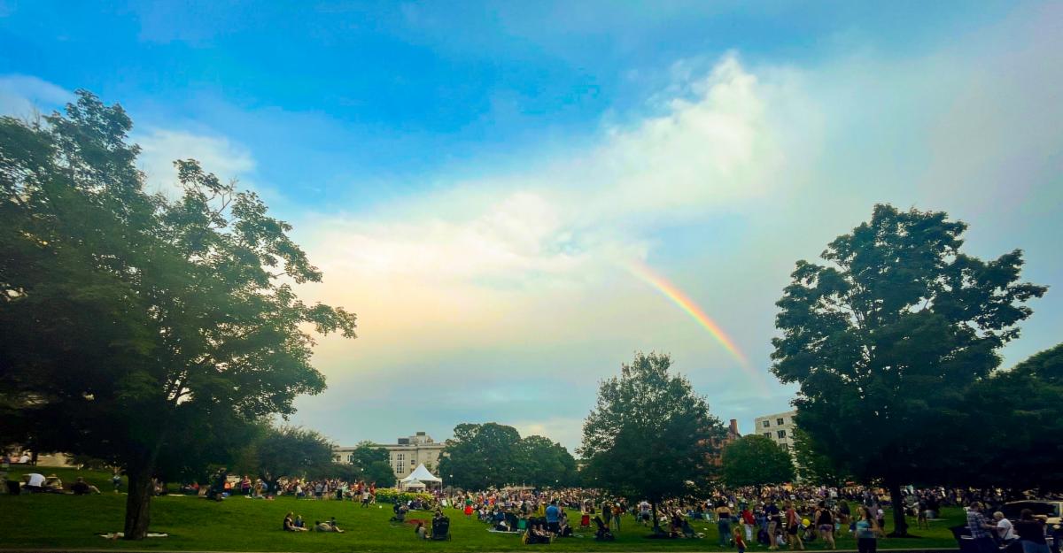Rainbow in sky above Independence Day celebration in Montpelier