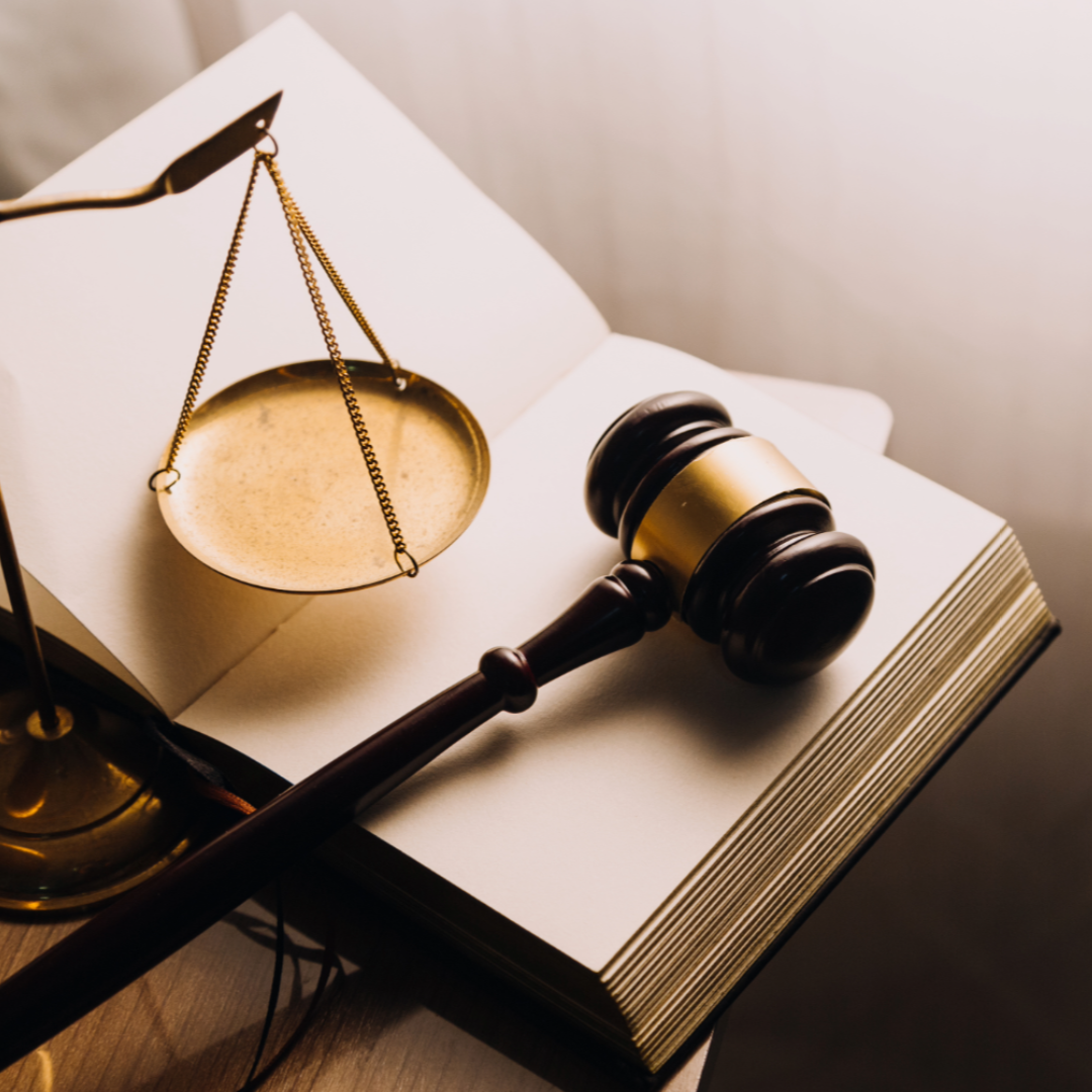 Book, gavel and scale, all representing law