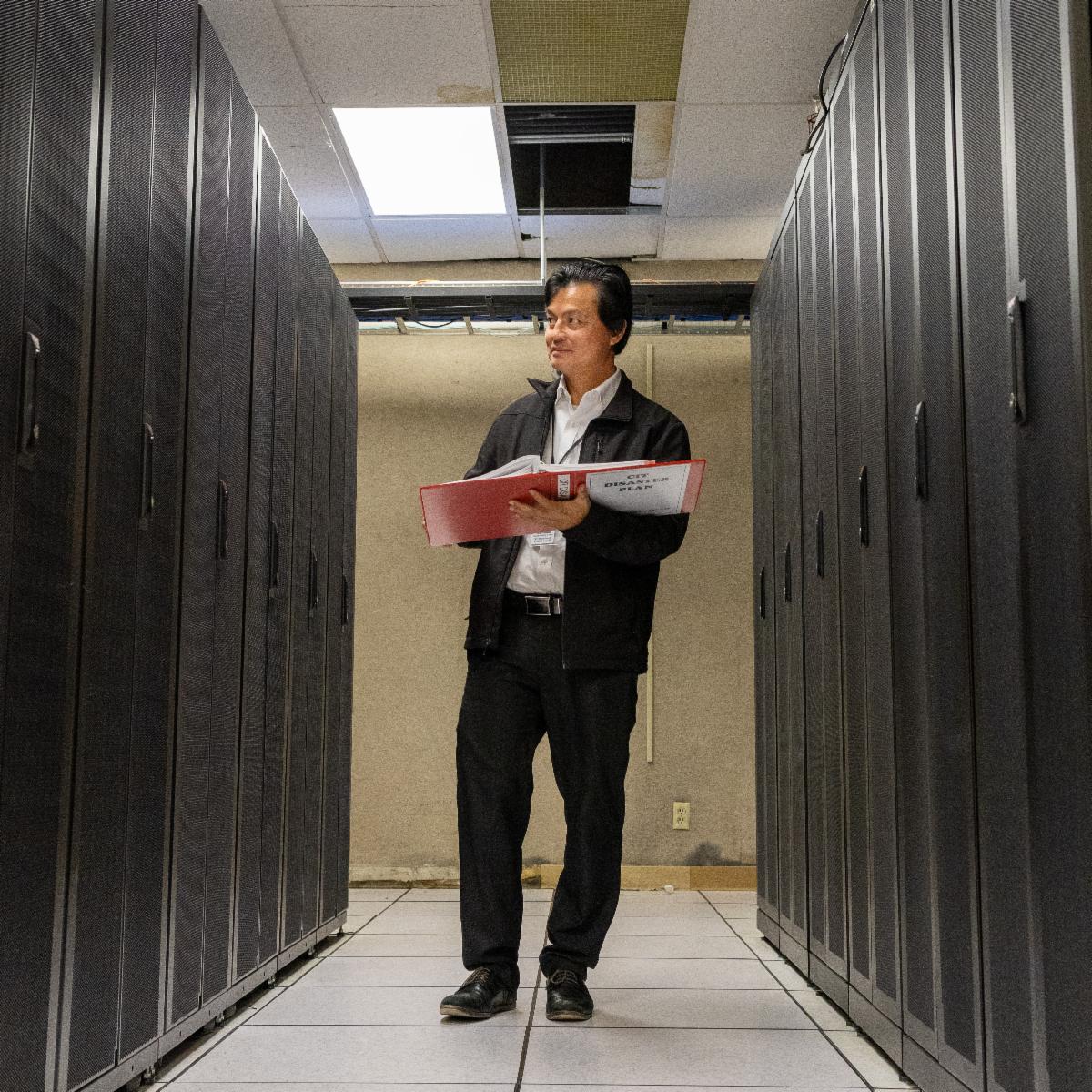 An employee inside a data center