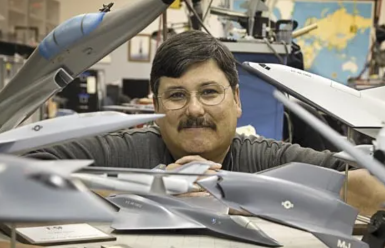 Northrop Grumman Aeronautics Systems Sector Historian Tony Chong with his models