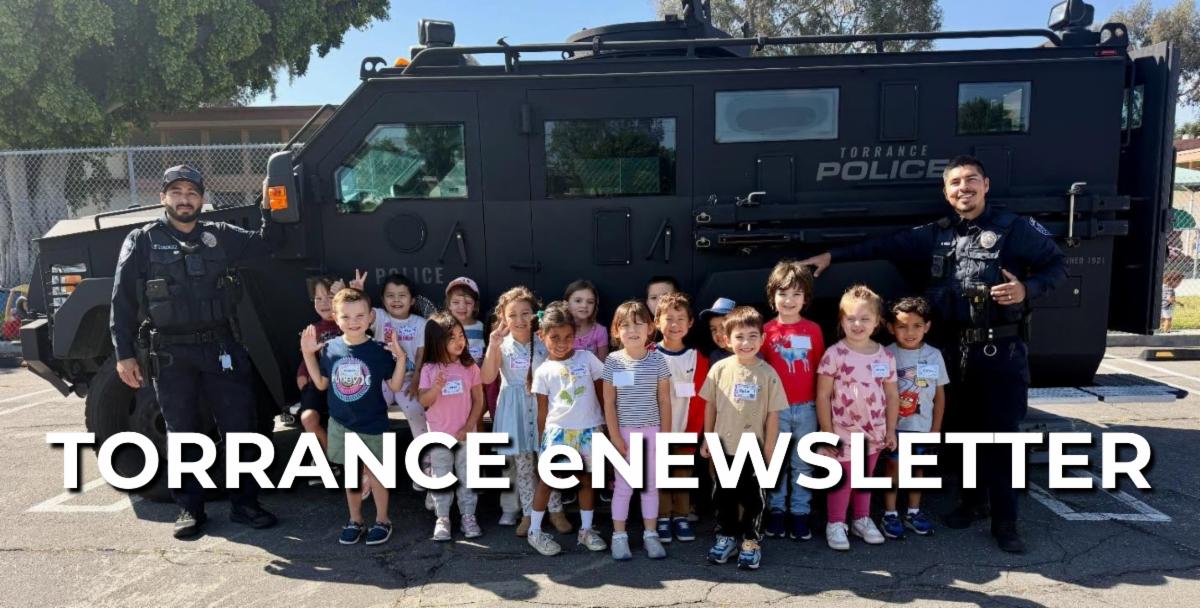Torrance Police visiting kids at Recreation Enrichment Class and posing in front of the Bearcat vehicle