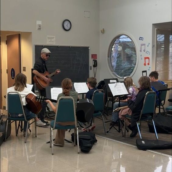 classroom setting with students playing instruments