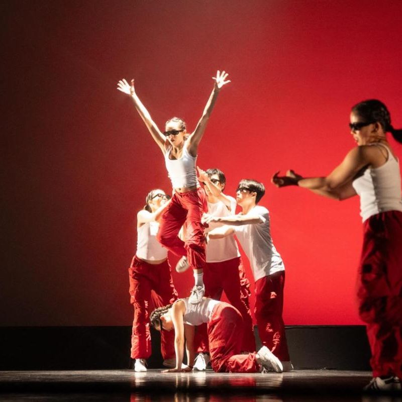 Torrance High performers executing a stunt at the auditorium for Torrance High Dance event