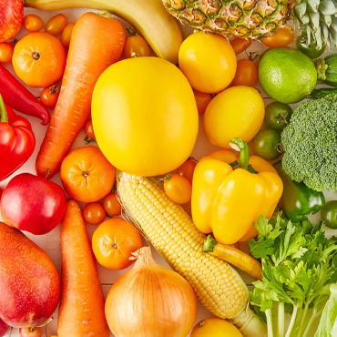 fruits and vegetables arranged by color from red to orange to yellow to green