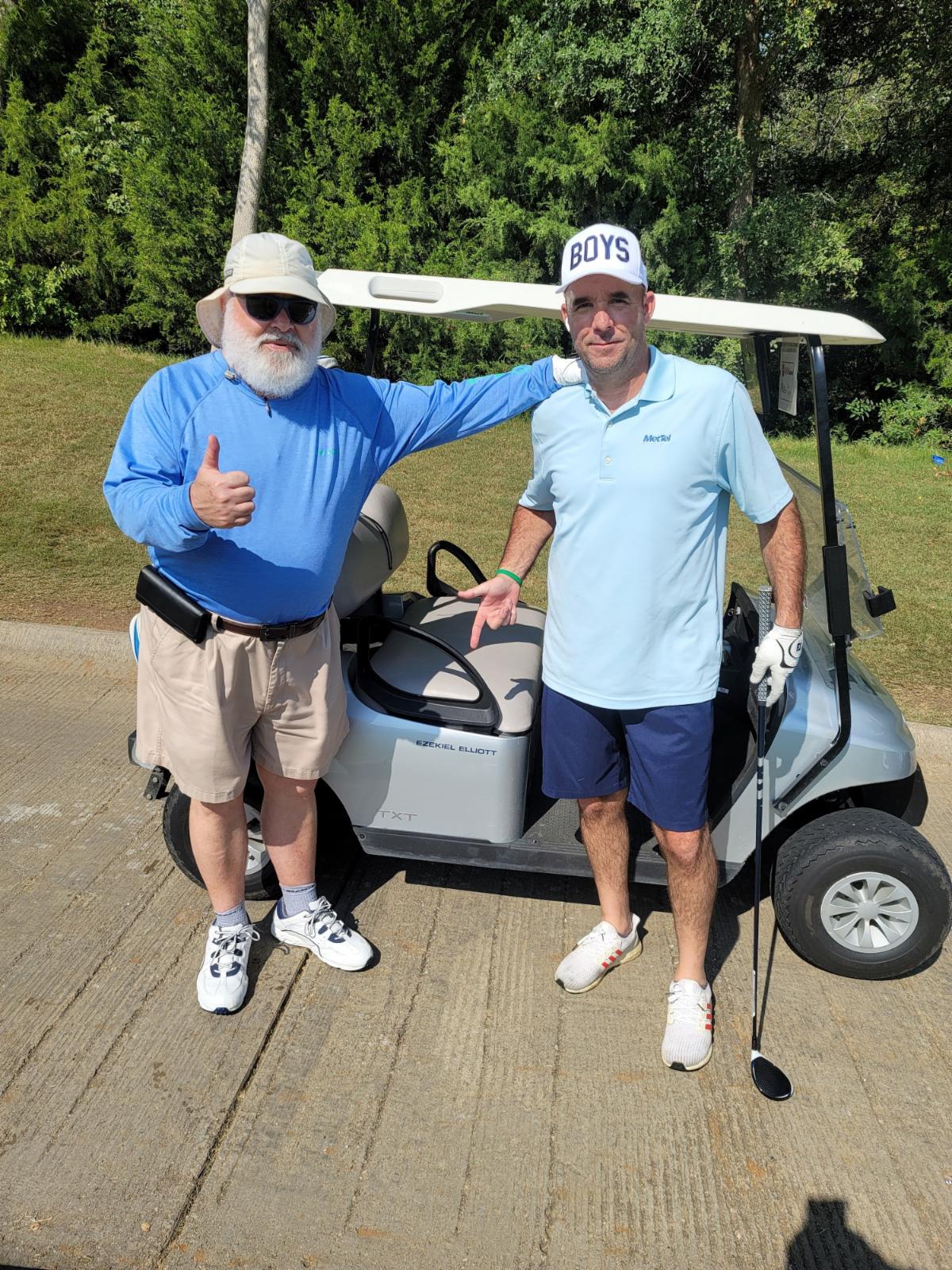 Randy _ Mike in Ezekiel Elliots Golf Cart.jpg
