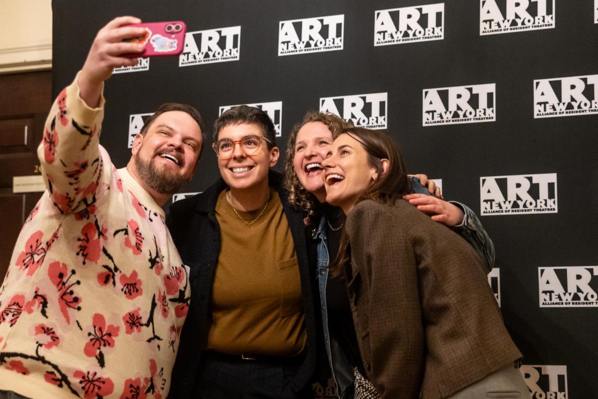 Four people stand in front of the ART New York banner and take a selfie. Amongst them is Risa Shoup and Talia Corren. 