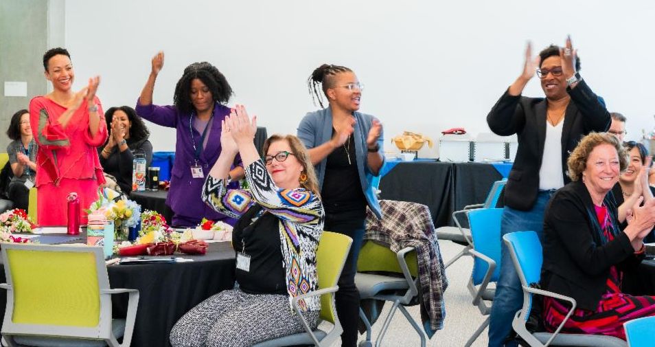 Photo of people celebrating indoors. 