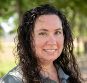 A photo of a women with dark hair named Brianne. 