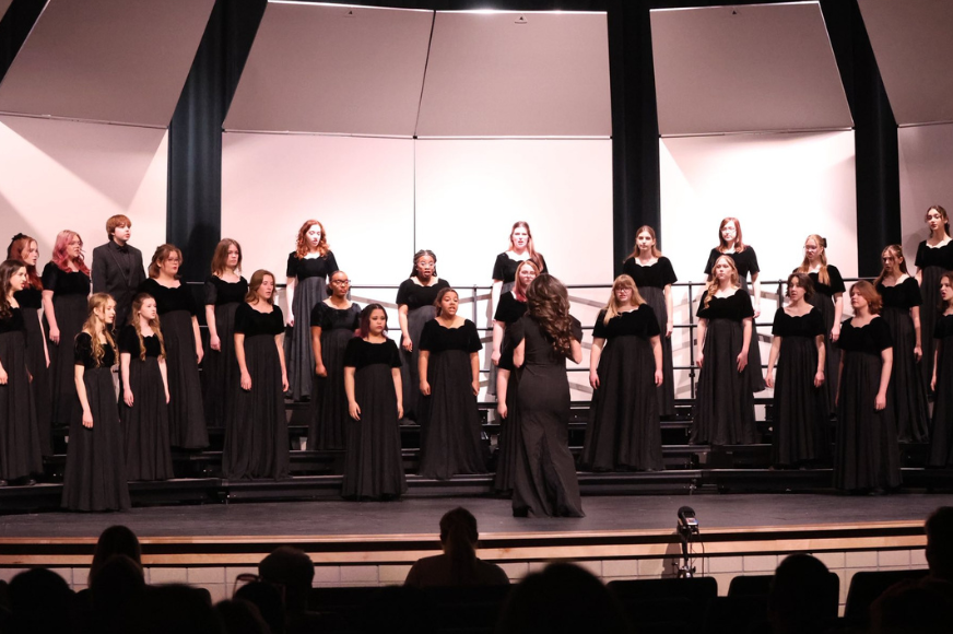 Francis Howell North's Bella Voce choir performs on a stage