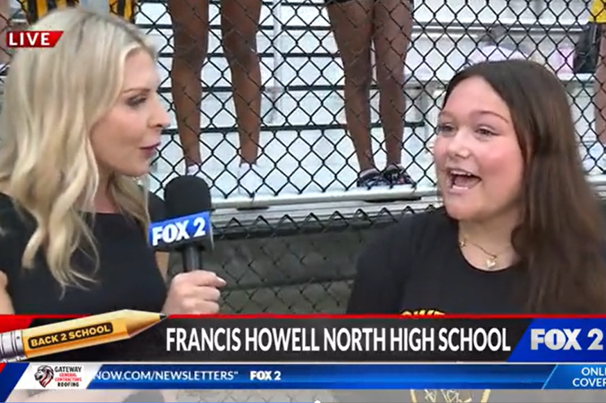 Fox 2 News reporter Laura Simon interviews a FHN student