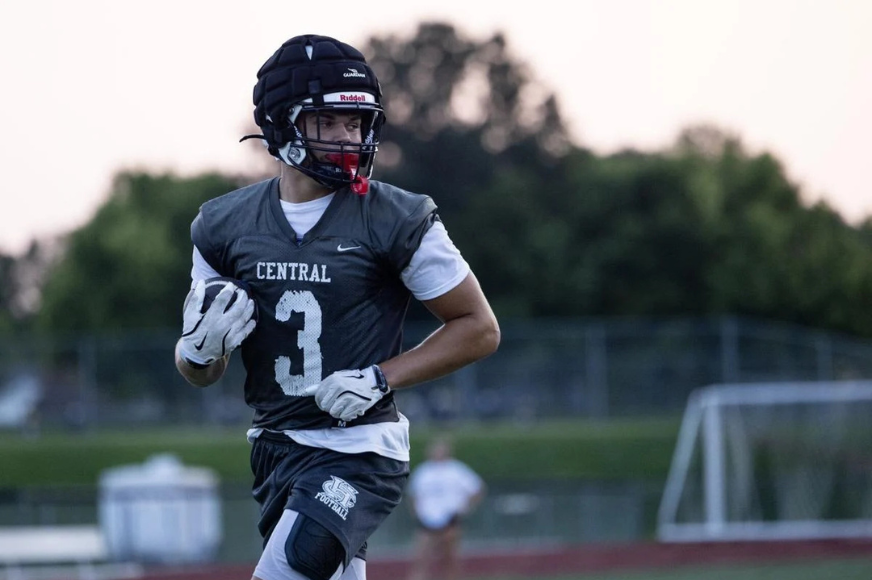 FHC football player Jack Brown runs with the football