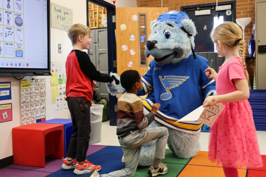 St. Louis Blues mascot Louie interacts with children at Becky David Elementary