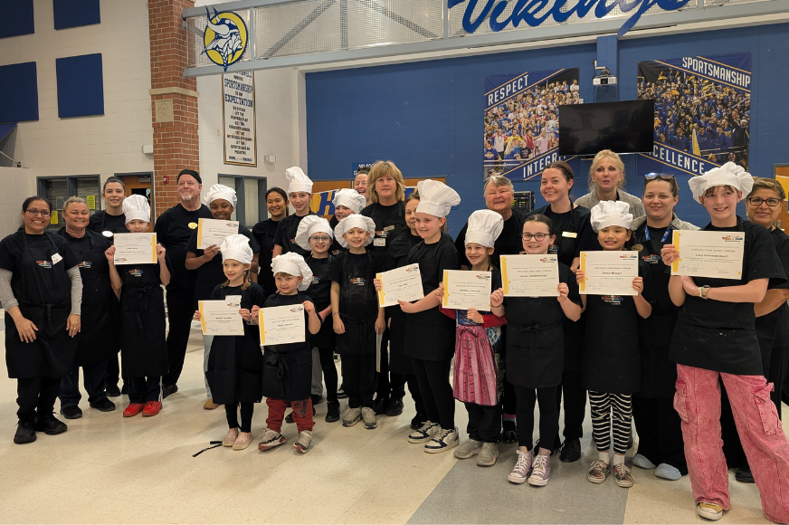 Students and staff pose for a photo at the Sodexo Future Chefs challenge