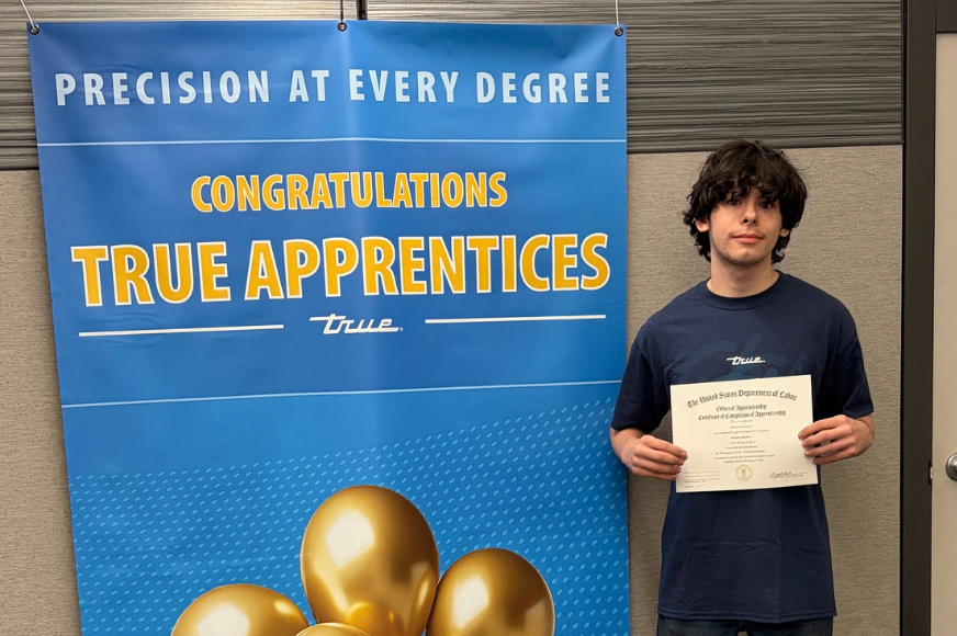 FHC student Nathan Inserra poses with a certificate celebrating the completion of his apprenticeship