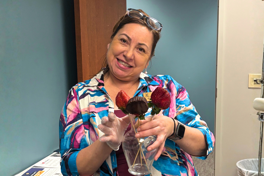 A Francis Howell School District employee offers snacks