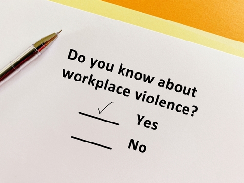 A person is answering question about hazards. He knows about workplace violence.