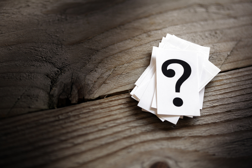 Question mark heap on table concept for confusion_ question or solution