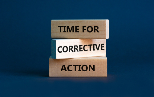 Time for corrective action symbol. Wooden blocks with words  Time for corrective action  on a beautiful grey background. Business_ time for corrective action concept. Copy space.