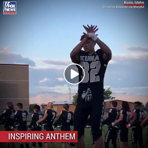 a football player signing the national anthem