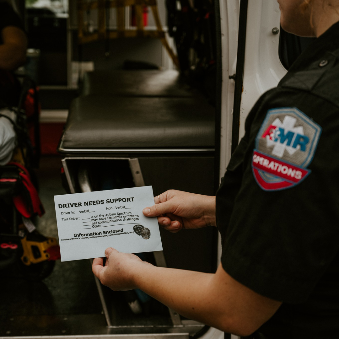 EMT holds a Blue Envelope