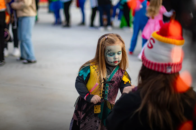 image of a little girl dressed as sally from nightmare before christmas trick or treating