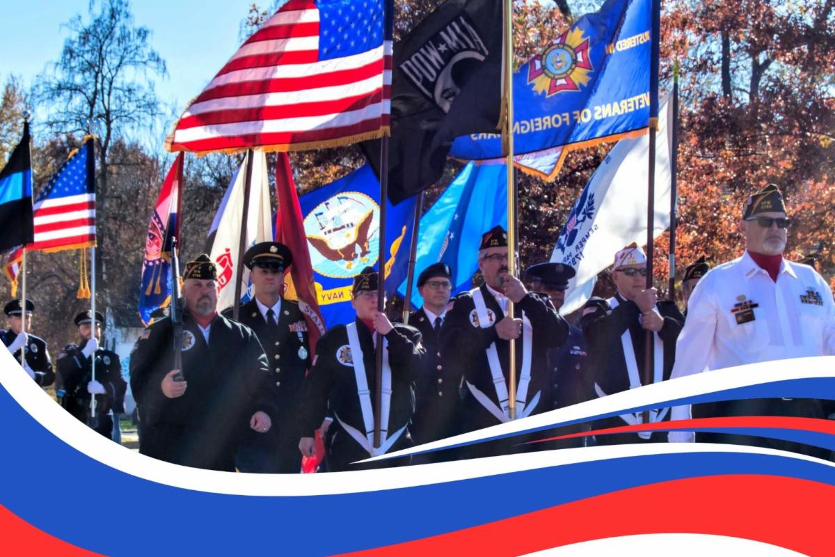 Image of veterans parade with american flags and military flags