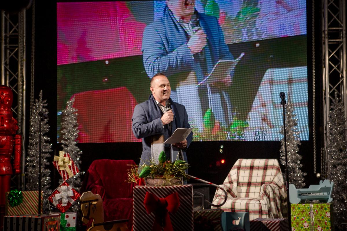 Group of people wearing jeans and cowboy boots line dancing