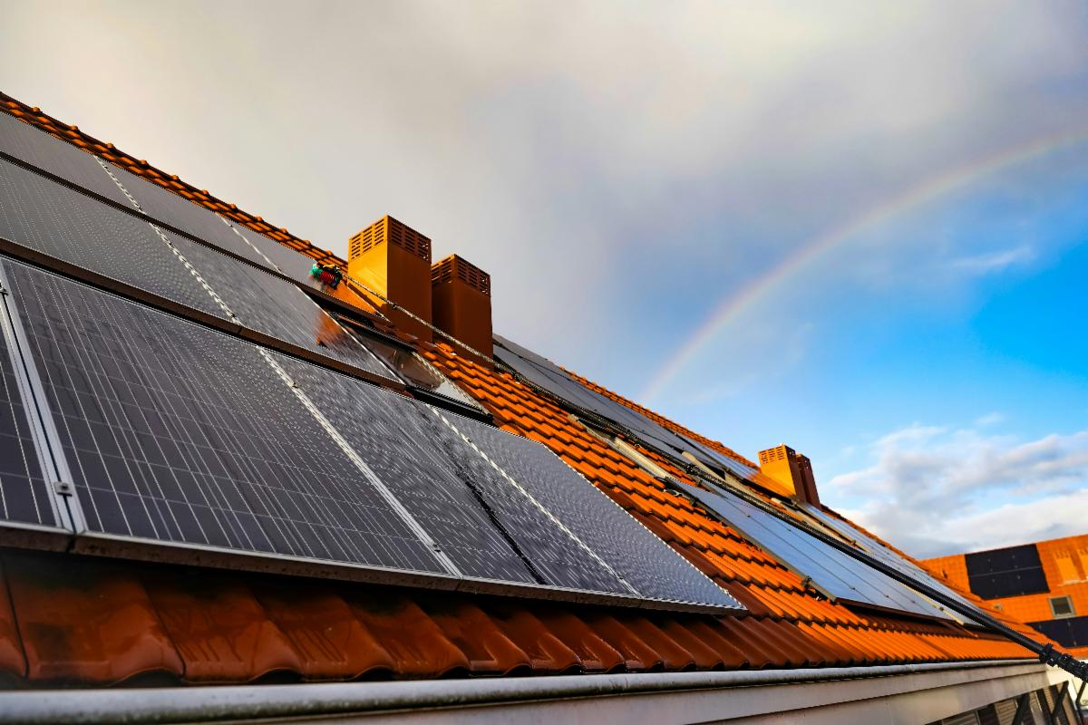 Photo by <a href="https://unsplash.com/@joshua_sx?utm_source=unsplash&utm_medium=referral&utm_content=creditCopyText">Joshua Bowers</a> on <a href="https://unsplash.com/photos/a-solar-panel-on-a-roof-with-a-rainbow-in-the-background-0SyvPKyZc-M?utm_source=