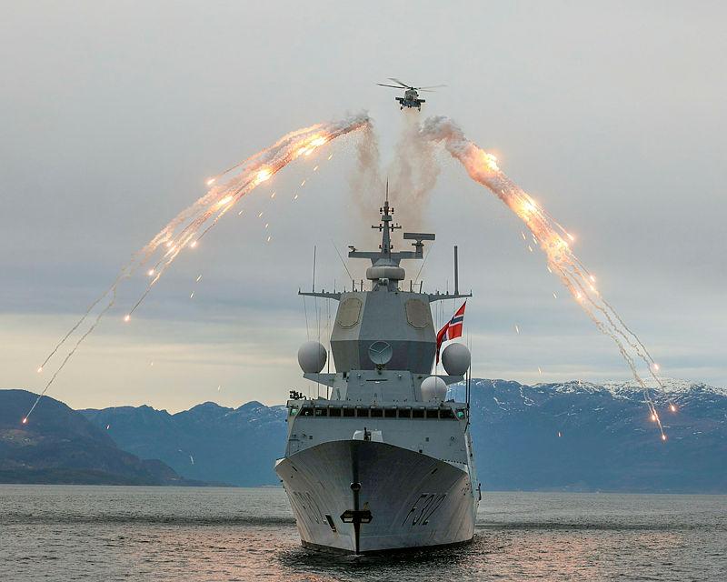 815 Naval Air Squadron Wildcat Helicopter dispense flares over HNoMs Otto during Exercise Tamber Shield.