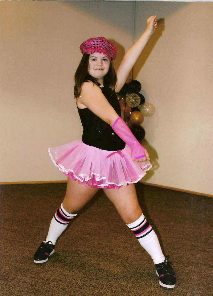 Photo of Kristin Fultz in a pink and black dance costume
