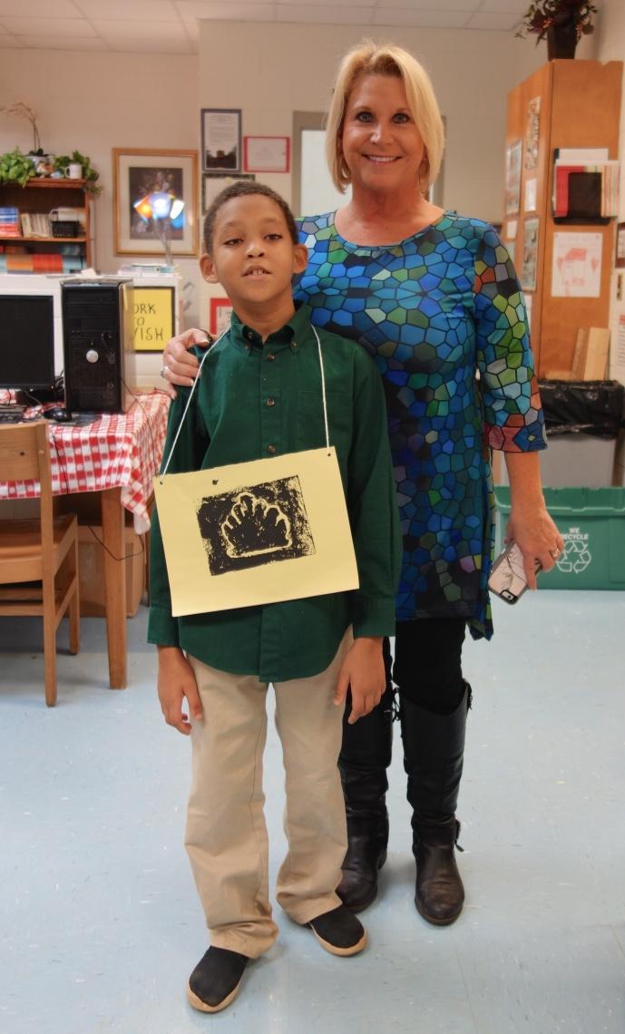 Young man standing with his teacher