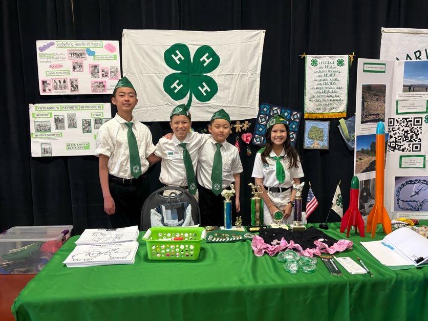 Marin 4-H members wearing their uniforms at the 4-H exhibitors table at Farm Day event