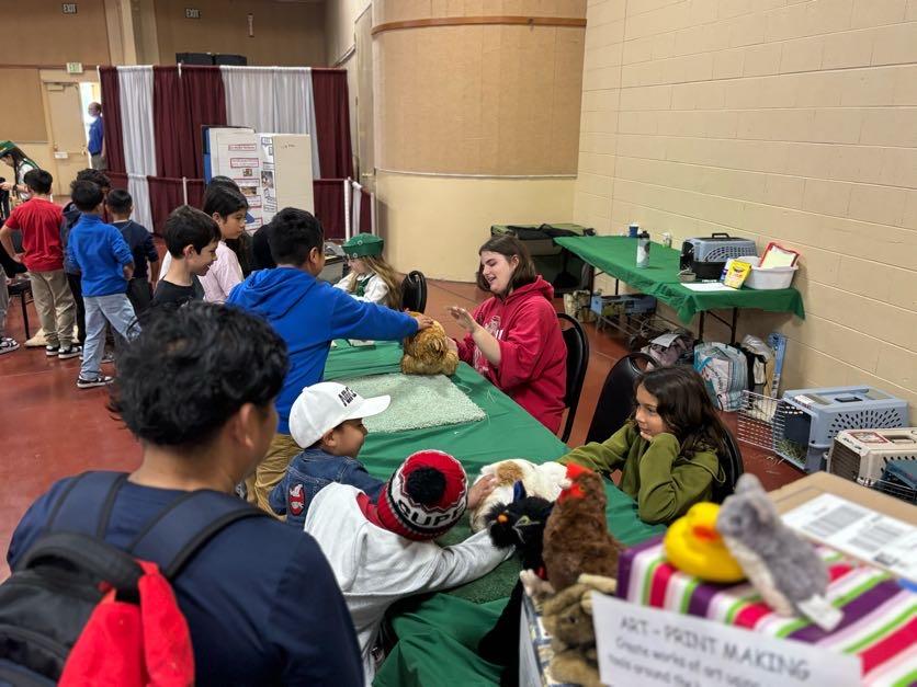 4-H members with their small animals- chicken, rabbit and Turtle at Farm Day Event