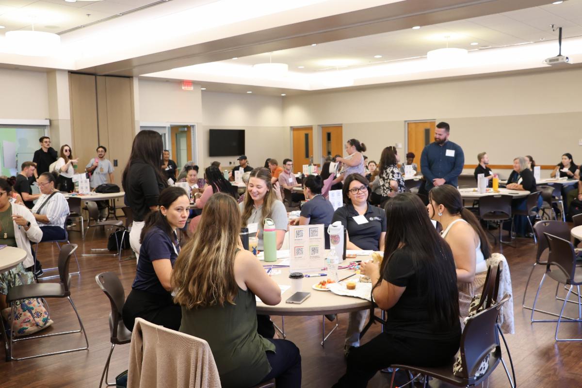 Attendees of the September 2026 Quarterly Partner Meeting mingling with one another in between sessions